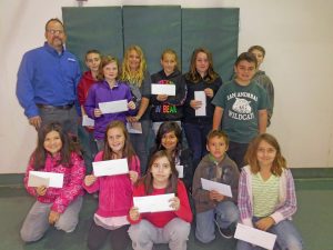 Hugh-presents-Pizza-coupons-to-winners-at-Assembly