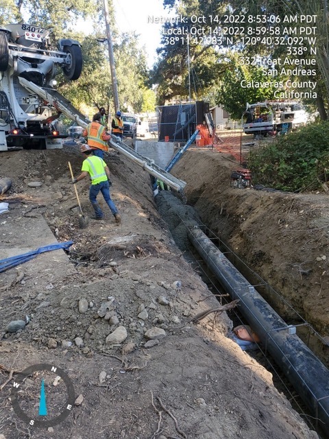 concrete being poured over sewer lines