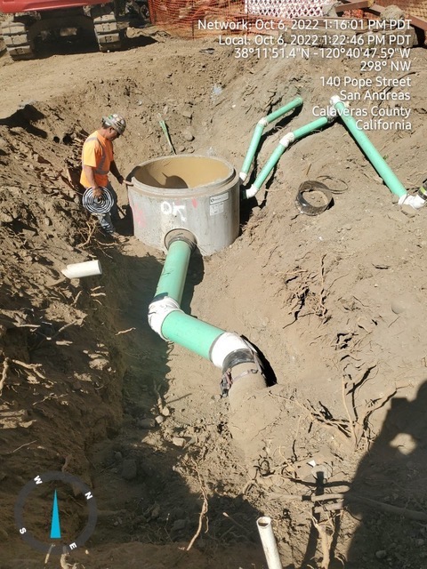 construction workers working on sewer main lines