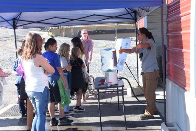 students receiving a science lecture outdoors