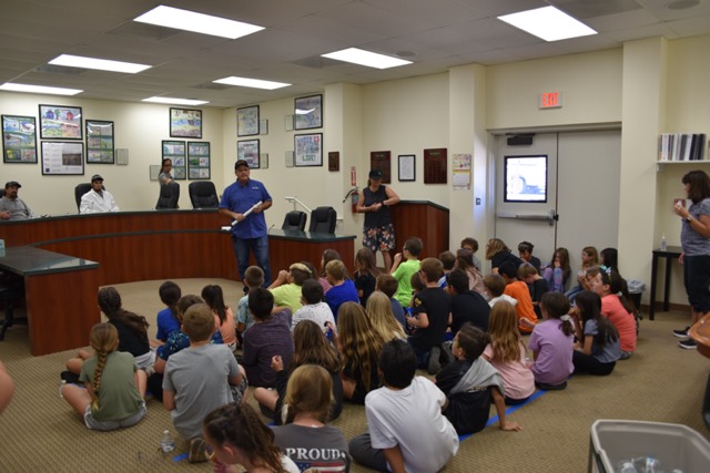 students seated in a board room